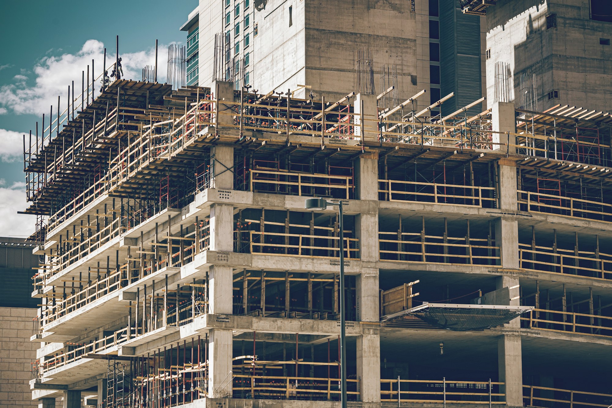 Construction zone. A new building is under construction. Commercial project. Office building. Cement